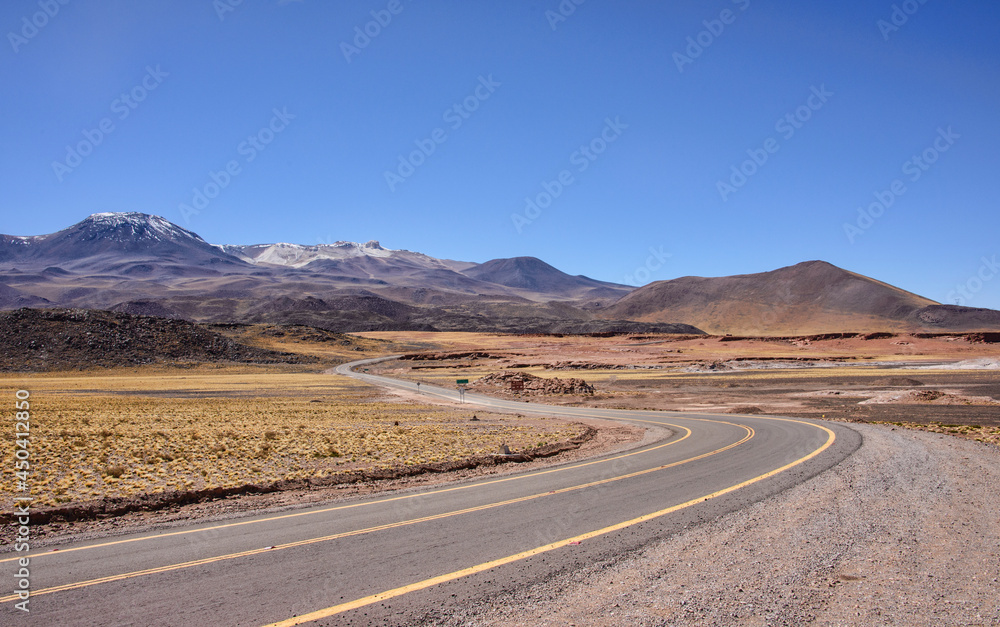 Driving through the amazing landscape of the Salar Aguas Calientes, Atacama Desert, Chile Driving through the amazing landscape of the Salar Aguas Calientes, Atacama Desert, Chile