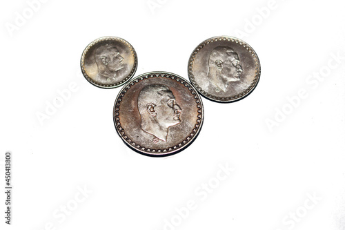 Old Egyptian silver coins of one pound, 50 piasters and 25 piasters 1970 subject President Nasser, commemorative coin for Gamal Abdel Nasser President of United Arab Republic, selective focus  photo
