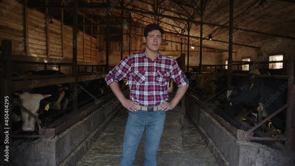 A beautiful farmer is smiling in camera proud with his work on a countryside farm A beautiful farmer is smiling in camera proud with his work on a countryside farm