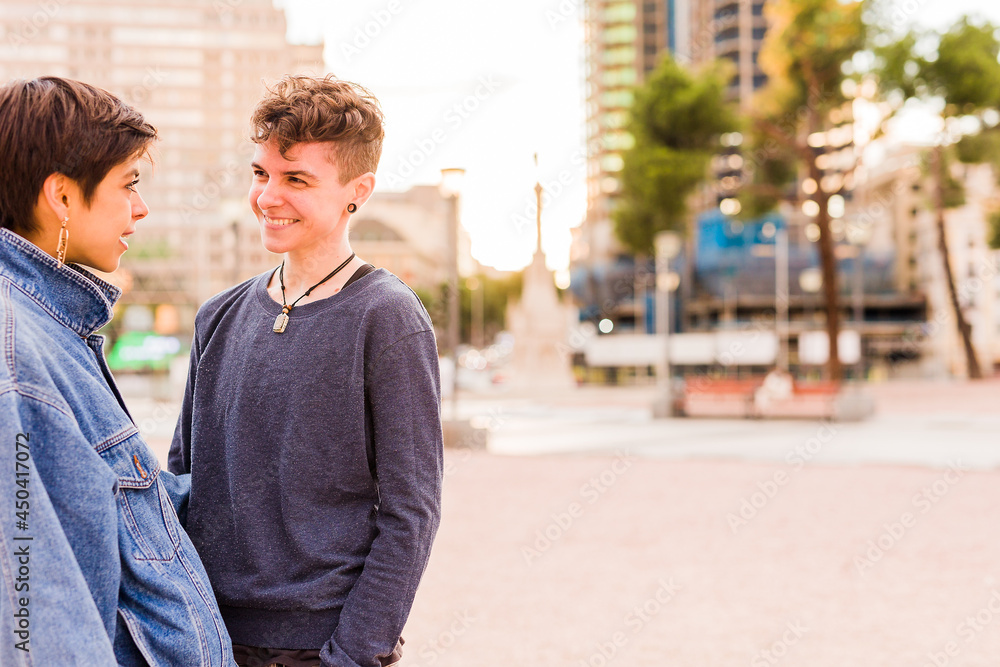 Young Tomboy lesbian couple. Androgynous non binary transgender and a