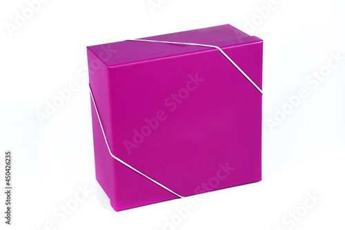 beautiful red gift box with closed lid with side view and space for text on white background