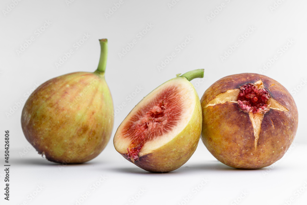 White background photo of figs cut in half. White background photo of figs cut in half.