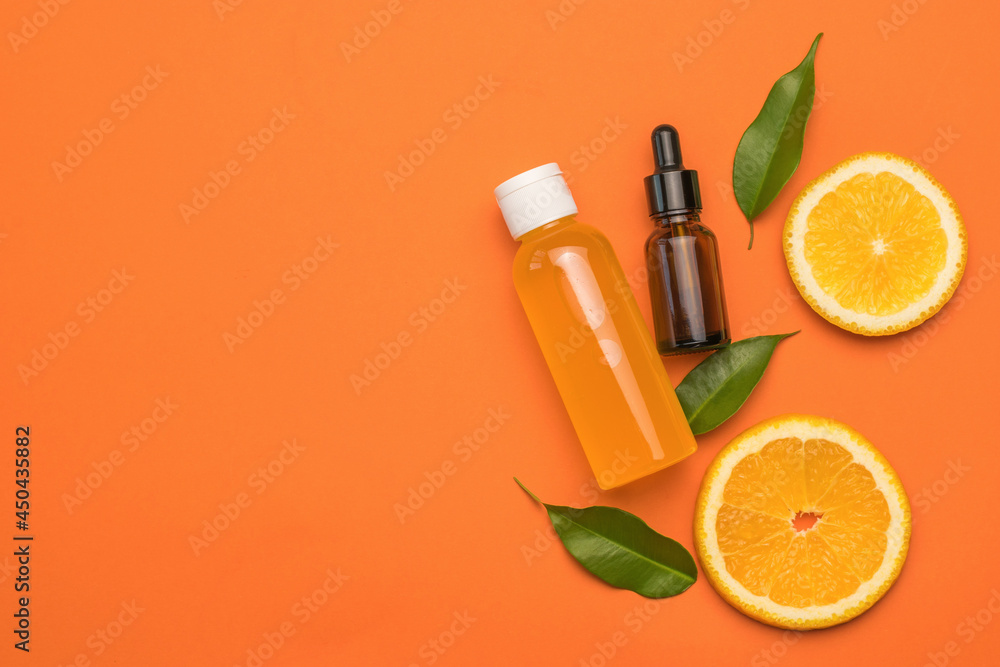 Oranges, a bottle of juice and a medical bottle on an orange background. Oranges, a bottle of juice and a medical bottle on an orange background.