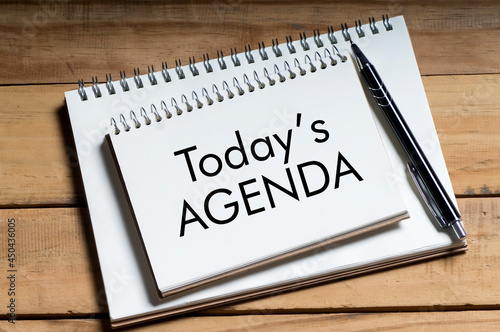 Today`s agenda text on noted pad