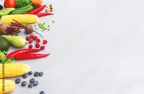 Flat lay with different vegetables, fruits, berries, nuts, spices, herbs