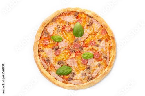 Italian meat pizza with tomatoes, three types of meat (sausages, bacon, minced meat), mozzarella cheese decorated with green basil leaves.