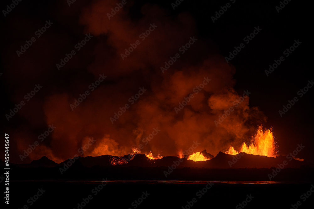The 2014 Bárðarbunga eruption at the Holuhraun fissures as seen at night from across a glacial river, Central Highlands, Iceland