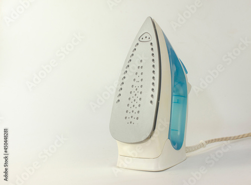 Electric Steam iron on white background. Empty copy space for text.