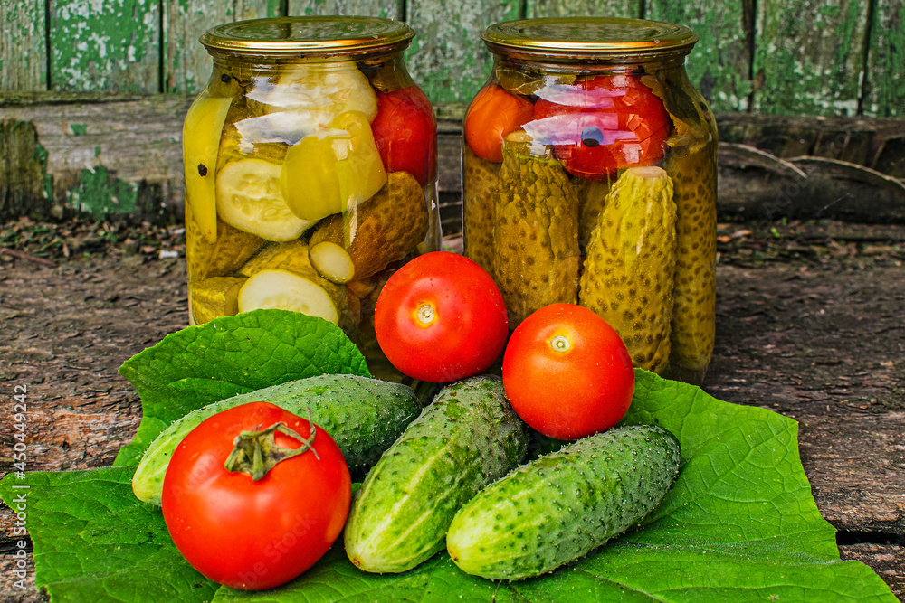 Cucumbers and tomatoes in a can for canning Cucumbers and tomatoes in a can for canning