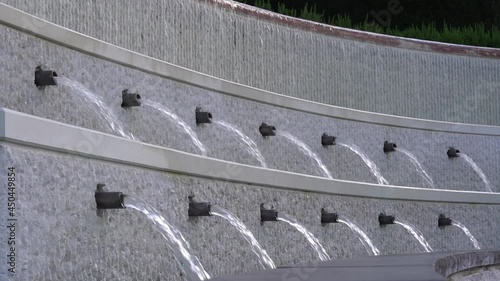 Water fountains at entrance of Olympic Museum at City of Lausanne on a hot summer day. Slow motion movie shot August 11th, 2021, Lausanne, Switzerland.