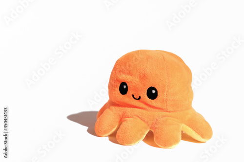 orange toy octopus isolated on white background. underwater animal collection