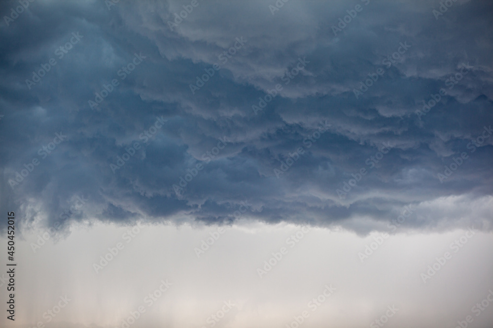 Dramatic sky with grey clouds over the city before the storm. Weather before or after a storm. Dramatic sky with grey clouds over the city before the storm. Weather before or after a storm.