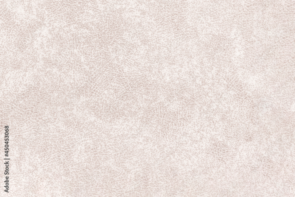 Fototapeta premium A pattern of mottled fabric with small spots. Light brown abstract blurred texture.