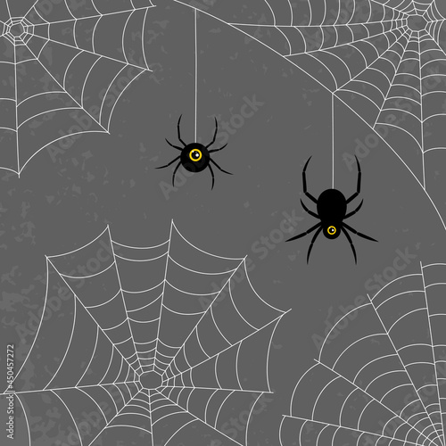 A set of web and spiders on a dark background