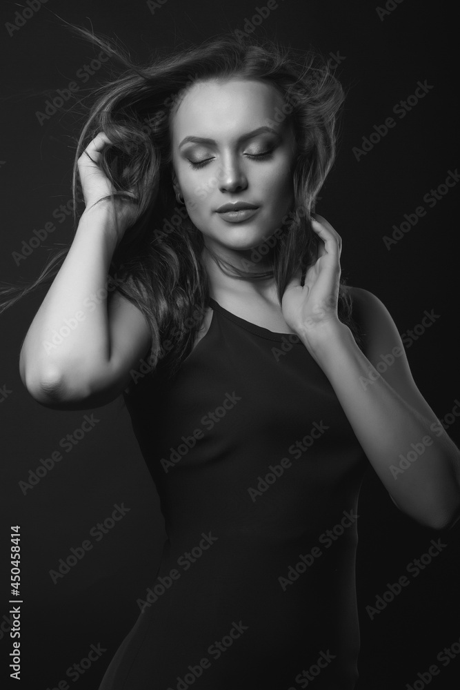 Stylish studio portrait of a attractive brunette woman with perfect makeup