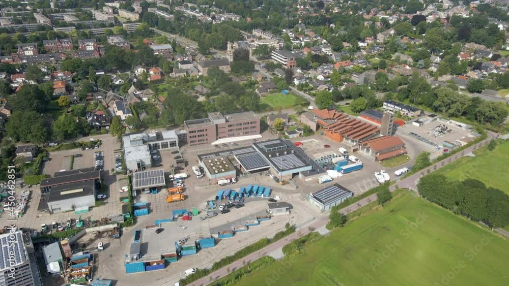 High aerial of cars driving on and off recycling station High aerial of cars driving on and off recycling station