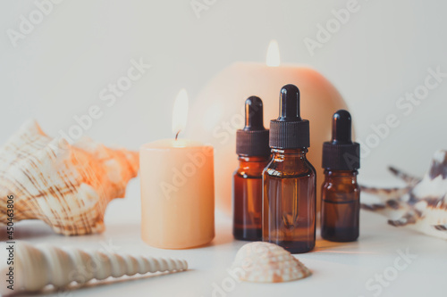 Brown glass bottles with serum  essential oil or other cosmetic product. Natural organic cosmetic packaging  skin care concept.