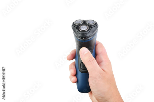 Картината върху платно Male hand holds an electric shaver on a white isolated background