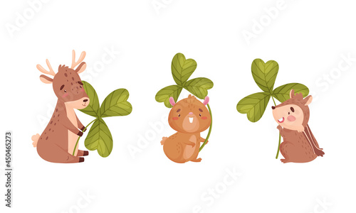 Cute baby animals with three leaf clover set. Adorable fawn, hamster, chipmunk holding shamrock leaves cartoon vector illustration