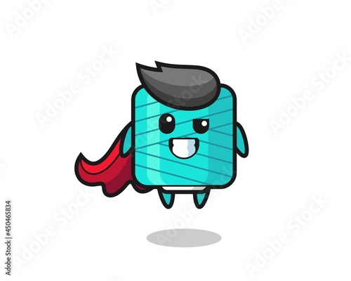 the cute yarn spool character as a flying superhero