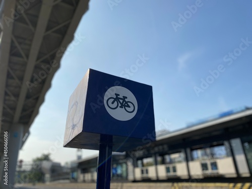 Parking area for bicycles in East Jakarta, Indonesia in blue sky, bridge, bus stop and highway background