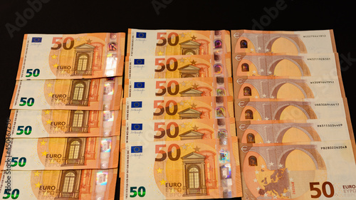 winning the lottery, euro on a black background, texture of money.