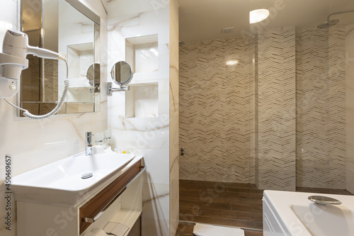 Bathroom interior with tiled walls