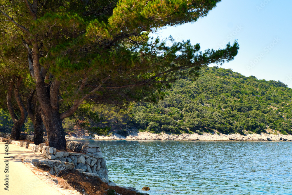 Coastline road to idyllic and lonely remote beach for vacations escape - Valun beach on Croatia island Cres
