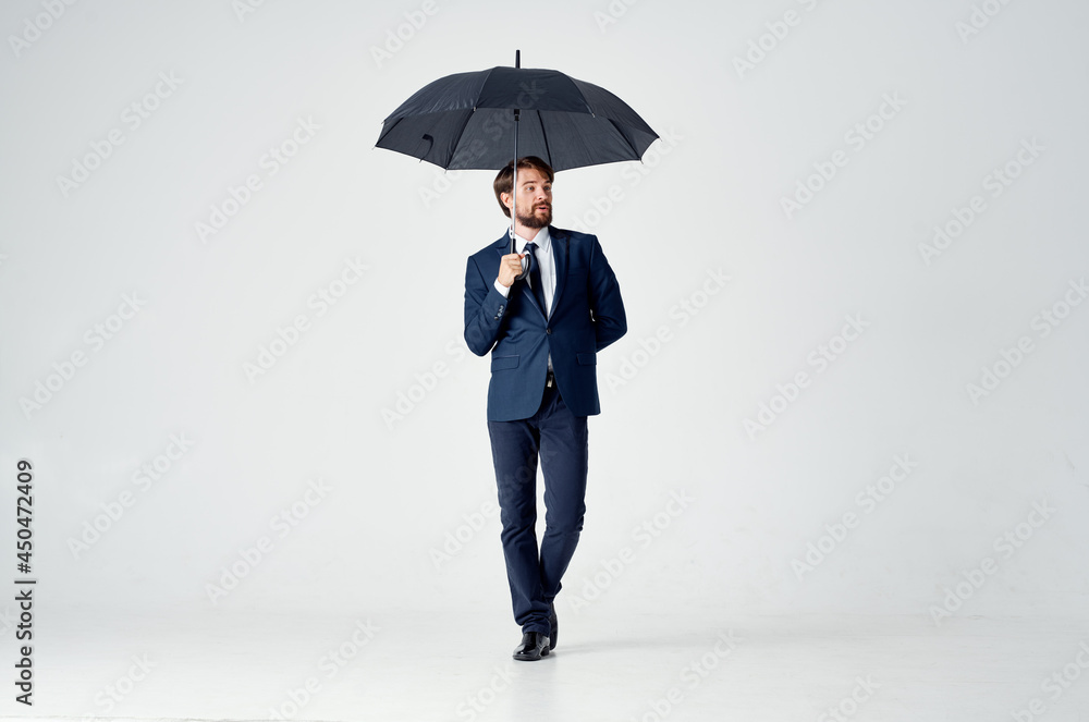 business man in a suit umbrella overhead protection business man in a suit umbrella overhead protection