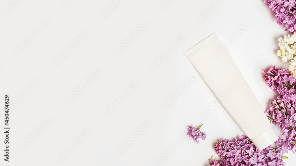 Organic skin care products on white background with fresh green lilac flowers twigs. Organic skin care products on white background with fresh green lilac flowers twigs.