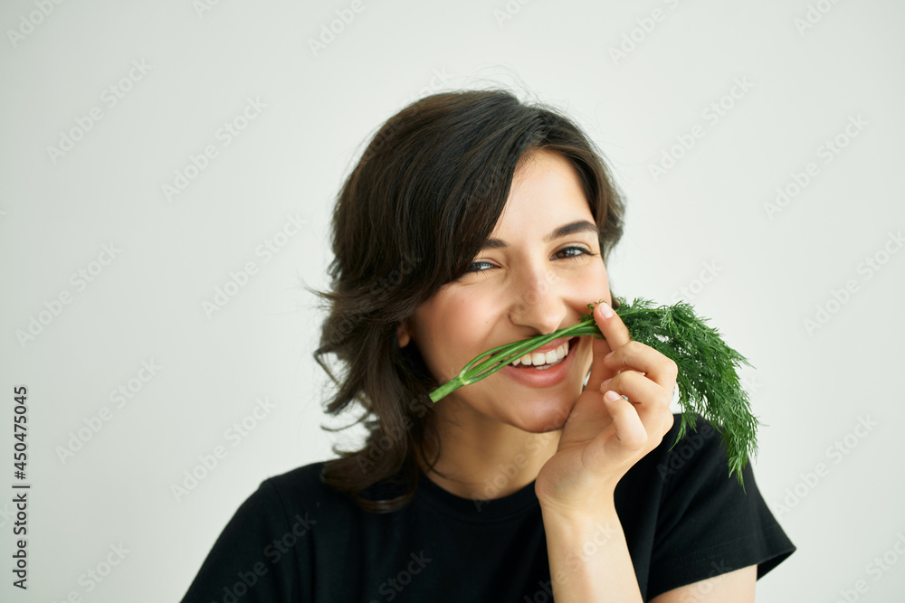 cheerful woman in a black t-shirt food healthy food cheerful woman in a black t-shirt food healthy food