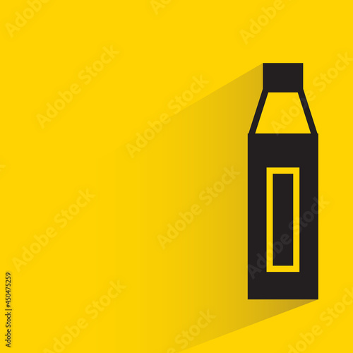 bottle with shadow on yellow background