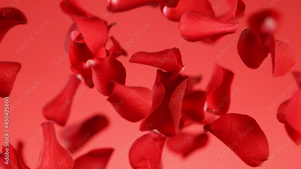 Freeze motion of rose petals flying on red background Freeze motion of rose petals flying on red background