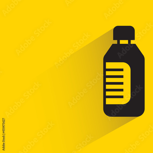 bottle with shadow on yellow background