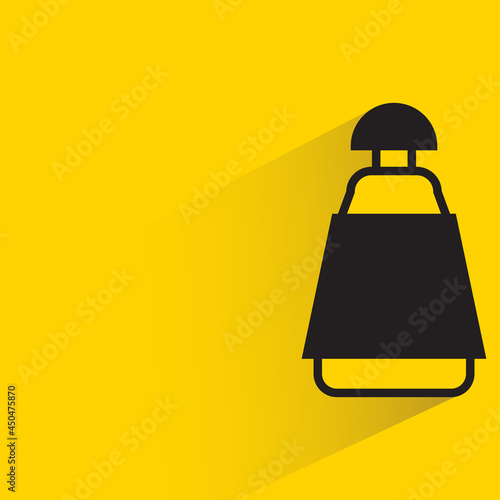 bottle with shadow on yellow background