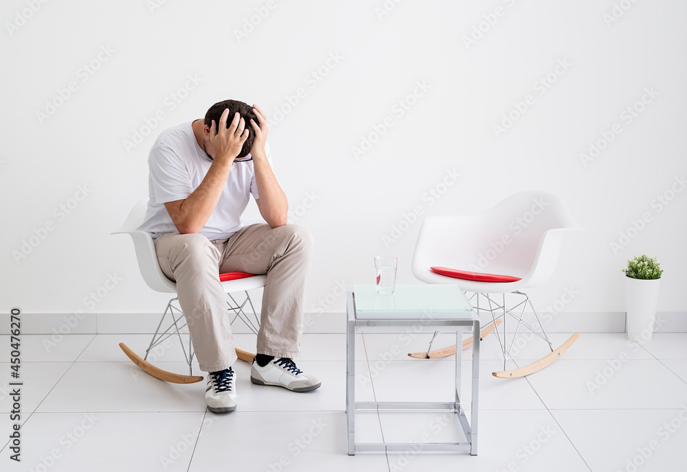 portrait of a tired man, stressed and with headache portrait of a tired man, stressed and with headache