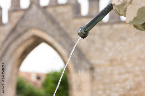 water coming out of an iron fountain