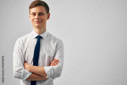 man in white shirt with tie gesturing with hands success emotions self-confidence