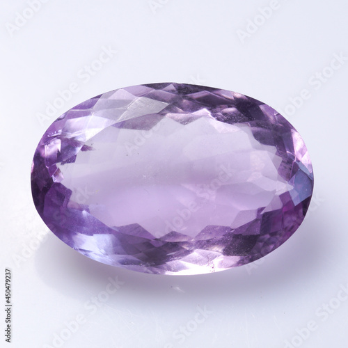 Natural stone purple amethyst on a white background