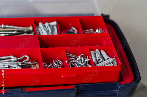 A toolbox with screws and nails