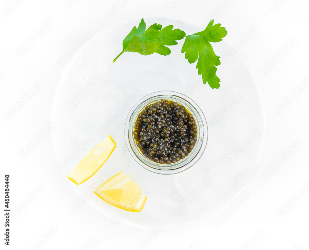 Appetizers of natural sturgeon black caviar, lemon and parsley