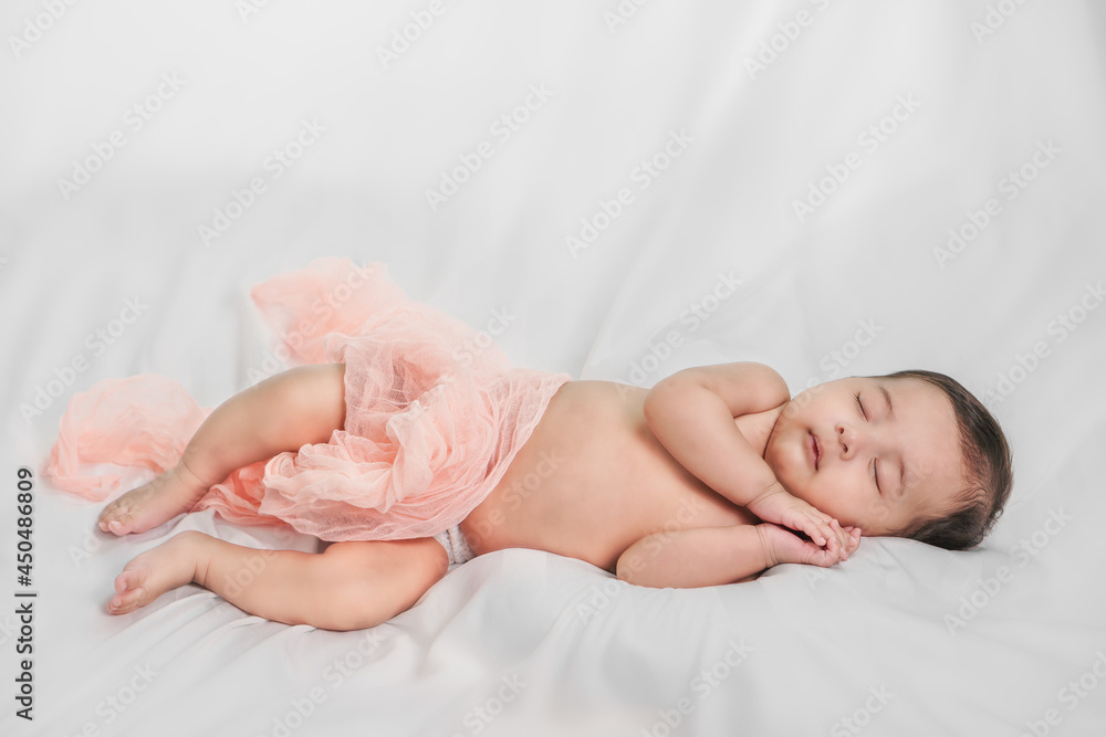 lovely baby boy sleeping on bed and holding hands lovely baby boy sleeping on bed and holding hands