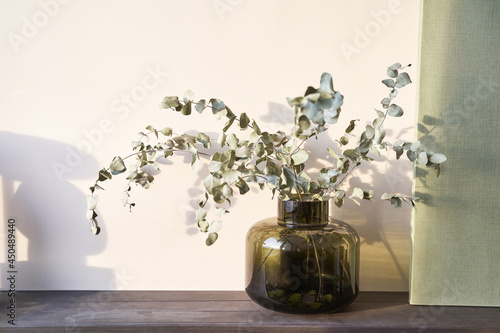 Trendy eucalyptus flower. Bedroom interior design. Minimal bouquet. Grass decoration. Home room composition. Indoor poscard