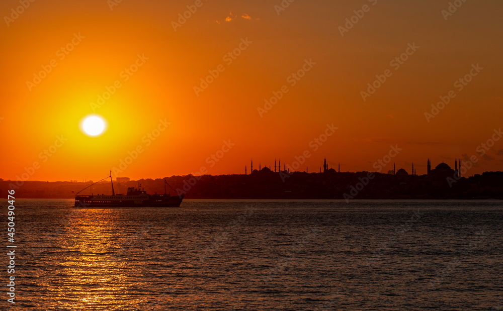 Sunset over Istanbul. Siluets mosques of a city