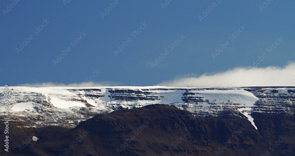 Obraz premium ridge from a mountain covered with ice and snow, Akureyri, Iceland