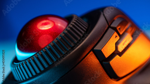 close-up Wireless Trackball Computer mouse on a blue background photo