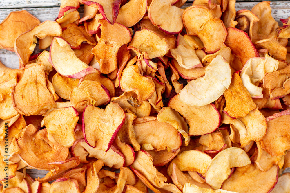 A pile of dried apples in slices. Dried fruit chips. Healthy food