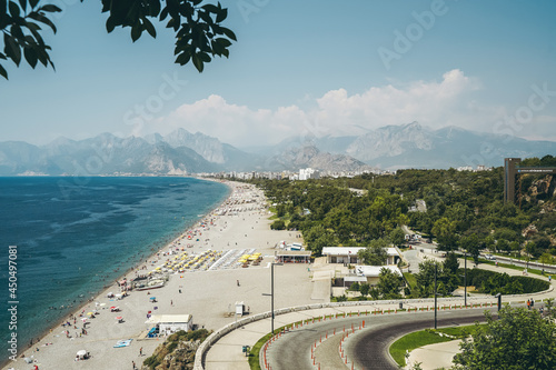 Fototapeta Naklejka Na Ścianę i Meble -   Konyaalti beach in Antalya, Turkey. Long Turkish beach on the Mediterranean sea in warm sunny summer weather. Rest of tourists at the seaside resort