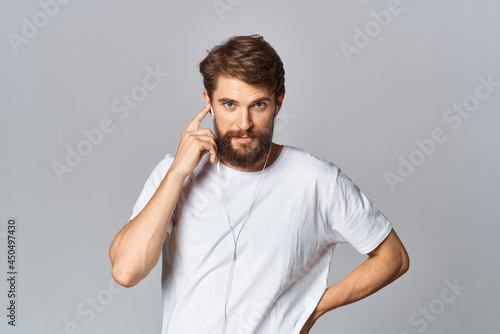 man in white t-shirt with beard lifestyle casual wear Studio light background