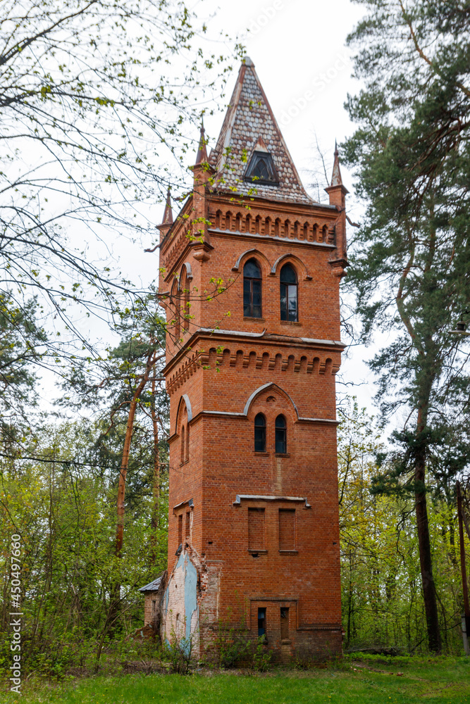 Naklejka premium Old brick water tower in Natalyevka park in Kharkiv region, Ukraine